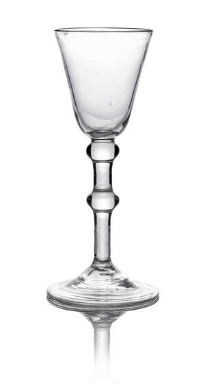A George III drinking glass, with tapering bucket bowl, on clear glass stem with double knop, on spreading fold over foot, 15.5cm high