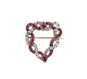 
	
		A late 18th / early 19th century diamond and ruby brooch, of shaped triangular form...