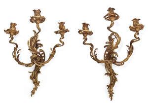 
	
		A pair of French Louis XV style gilt-bronze three-light wall appliques, late 19th century