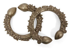 
	
		Two Nepalese white metal footrings, early 20th century, cast with two dragon heads and...