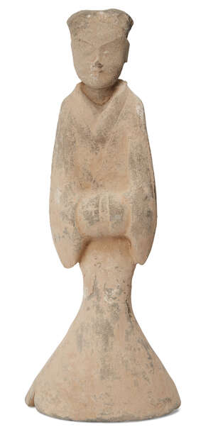A Chinese pottery figure of a court lady, Han dynasty, modelled standing wearing flowing robes with hands together concealed by long sleeves, 34cm high