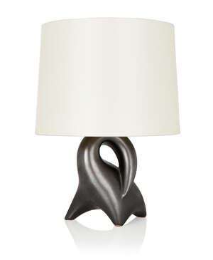 
	
		Manner of Roger Capron, 
		 
		Sculptural desk lamp of abstract zoomorphic form, circa...