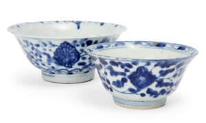 
	
		Two Chinese porcelain bowls, 19th century, painted in underglaze blue with flowering...