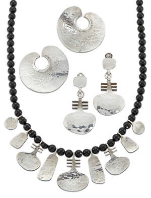 
	
		Mark of A.V., a silver and black glass bead necklace with two pairs of earrings,
		Each...