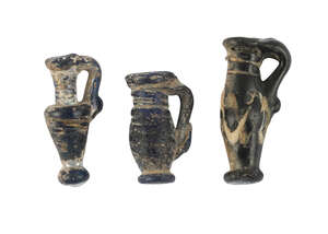 
	
		Three small glass vessels, possibly Roman, 2nd-4th century AD, each approx. 1ch. high (3)...
