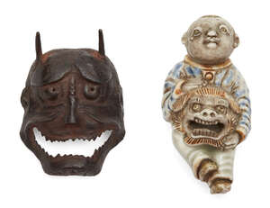 
	
		A Japanese porcelain netsuke, 19th century, modelled as a Chinese boy holding a lion...