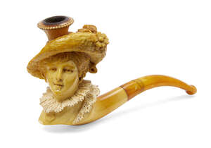 
	
		A meerschaum pipe, late 19th century, in the form of a lady with a floral hat and lace...