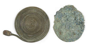
	
		Two Italic bronze fibulae, circa 8th century B.C. , 10cm. diam. and 10.2cm. diam. (2)
		