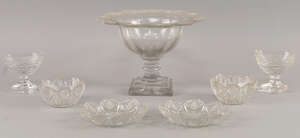 A cut glass sweetmeat dish, 1th century, the flared rim with crosshatch and fan pattern decoration, with facetted bowl and stem on square stepped base,23cm dia