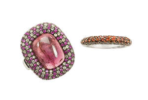 
	
		A garnet, ruby and diamond cluster ring, and a garnet half-hoop ring,  the first with...