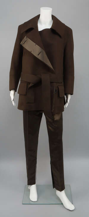 
	
		Gucci: a wool and silk suite, the chocolate brown thick wool jacket with large collar,...