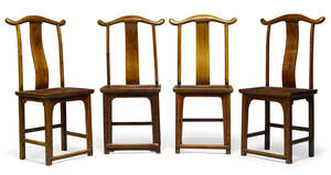 
	
		A set of four Chinese elm yoke-back chairs, 19th century, with rattan seats 

	

