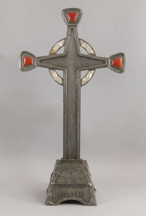 
	
		A metal and mother of pearl inlaid cross on a stand, 20th century, with red enamel...