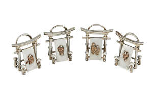 
	
		A set of four novelty silver menu holders, London c.1911, William Hutton & Sons Ltd., 