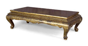 
	
		A modern black lacquered and gold coffee table, in the Chinese taste, late 20th century,...