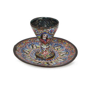 
	
		A Qajar gilt and enamelled copper cup and saucer, Iran, 19th century, the cup on a...