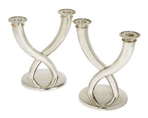 
	
		Gio Ponti (1891-1979), a pair of plated candelabrum  
		c. after 1983, stamped marks to...