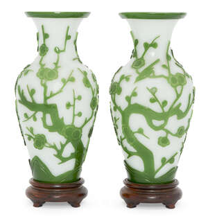 
	
		A pair of Chinese Peking green-overlay glass vases, late 19th century, carved with...