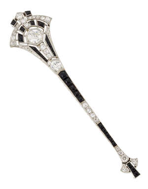 
	
		 An Art Deco, platinum diamond and onyx bar brooch, of  geometric design in the form of ...