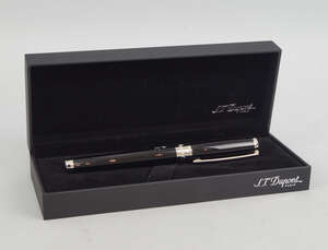 
	
		A Dupont ball-point pen, with black and silver finish, bearing the arms of Oman, in...