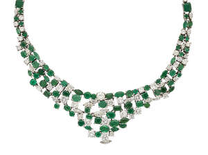 An emerald and diamond necklace, the front section in the with claw-set circular, oval and...