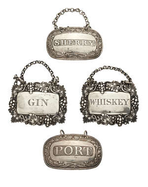 A pair of Victorian silver wine labels, Birmingham, c.1874, Yapp & Woodward (John Yapp & John Woodward), Whiskey and Gin, together with a pair of Georgian silv