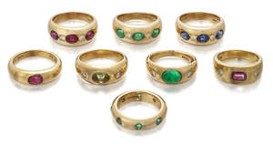 
	
		A groups of eight  gem-set  band rings, variously set with emeralds, rubies, sapphires...