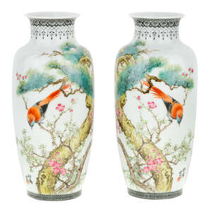 
	
		A pair Chinese famille rose vases, 20th century, each painted with a bird among prunus...