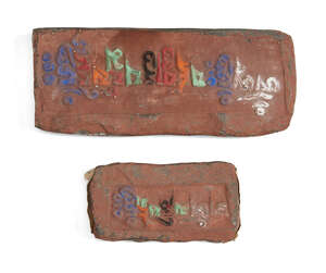 
	
		Two moulded stone fragments, Tibet, early 20th century, with typed dedicatory inscription...