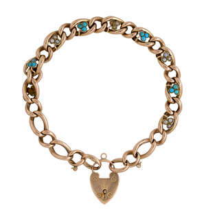 A late 19th century / early 20th century gold, turquoise and half-pearl bracelet, of curb link design set at intervals with turquoise or half-pearl three stone