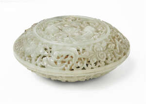 
	
		A Chinese reticulated pale green jade circular box and cover, Qianlong period, carved and...