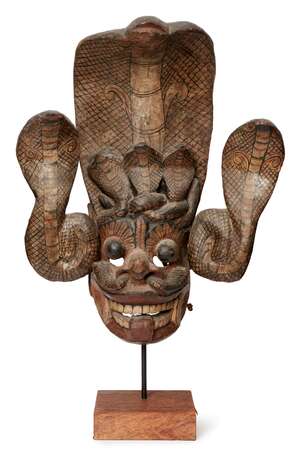 
	
		A wooden mask, Ceylon (Sri Lanka), 19th century, with museum label to reverse, the...