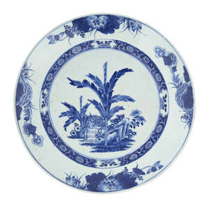 A Chinese export porcelain dish, 18th century, painted in underglaze blue with a deer amongst bamboo and flowers, within a border decoration of lotus, peony an