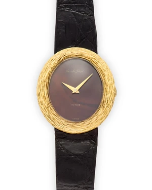 Bueche-Girod. An 18ct gold manual wind wristwatchLondon hallmarks for 197017 jewel manual wind calibre 68 movement, brown lacquered dial in the style of tiger'