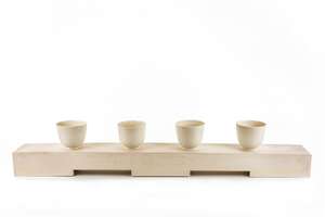 
	
		Julian Stair (b.1955),  
		 
		Studio Pottery four cups on a ground, circa 2000s, 
		