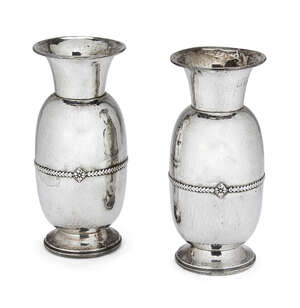 A pair of Arts & Crafts hammered silver vases, Birmingham, c.1923, Albert Edward Jones, of rounded amphora form with a single laurel leaf band to body intersec