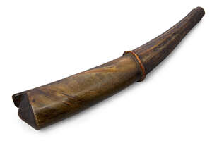 
	
		A large horn flask, 19th century, carved in two sections with wood stopper, 34cm...