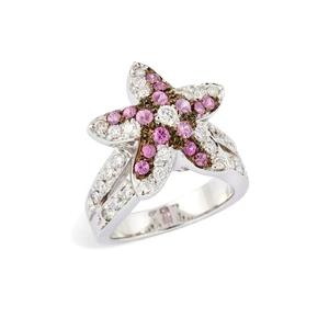 A diamond and pink sapphire ring, the central plaque designed as a starfish, set with five...