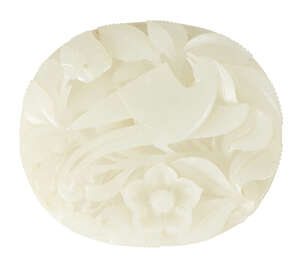 
	
		A Chinese pale celadon hardstone oval plaque, late Qing dynasty, carved with a phoenix...