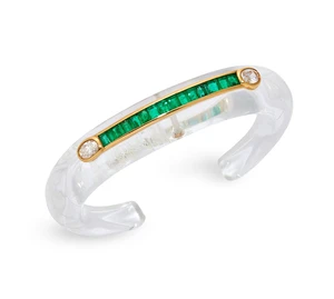 A rock crystal, emerald and diamond bangle, the carved rock crystal torque bangle with applied collet channel-set with a row of calibré-cut emeralds, with ova