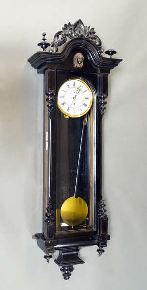 
	
		An Austrian ebonised wood Vienna regulator, 20th century, of typical form with pendulum...