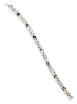 A diamond and coloured diamond bracelet, designed as a series of textured, heart shaped links...
