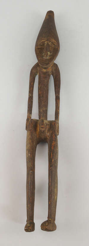 
	
		An Sepik ancestor figure of a man, with long stylised face and slender body, 51cm...