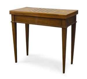 
	
		An Italian walnut and inlaid games table, 18th Century, the fold over top inlaid with...