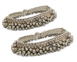 
	
		WITHDRAWN; A pair of silver anklets, India, 20th century, composed of a series of panels...