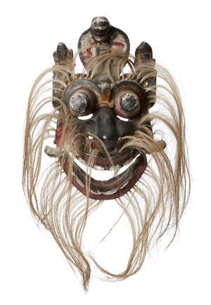 
	
		A wooden mask, Ceylon (Sri Lanka), circa 1900, with bulging eyes, movable jaw, three...