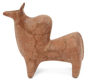 A substantially restored North West Iranian pottery rhyton in the form of a bull with prominent hump behind the neck, with open spout formed from the mouth, a 
