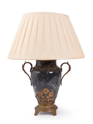 A French brass-mounted black marble twin-light table lamp, second quarter 20th century, with twin handles and floral mount, on a fluted base, with pleated fabr