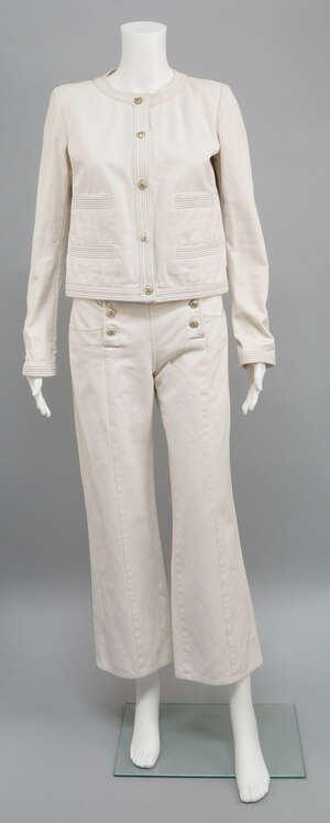 
	
		Chanel: an ivory cotton trouser suit, the collarless jacket with contrasting grey...
