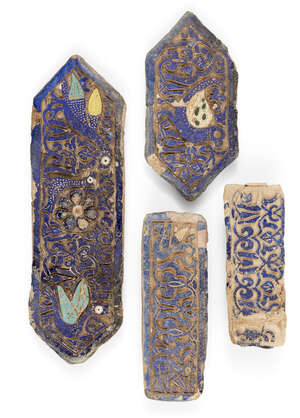 
	
		Four deeply carved tiles, Iran, 19th century, the largest of rectangular form with...
